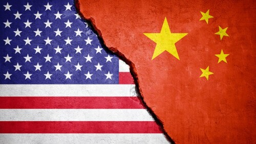 U.S. and Chinese flags in concrete, broken in the middle