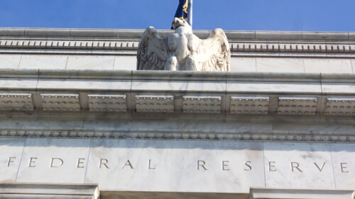Close up of the Federal Reserve building with the eagle statue.