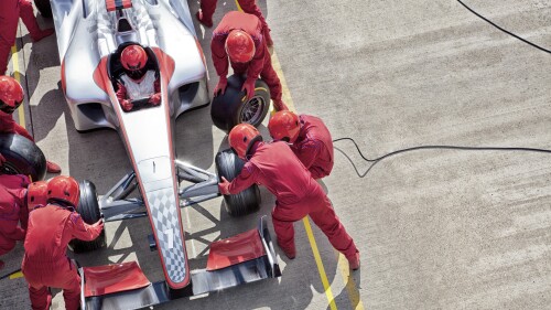A pit crew working on a race car