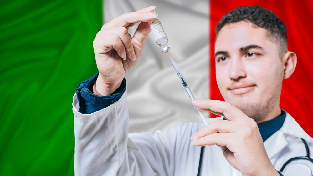 Doctor holding syringe on Italy flag background. Medical professional holding syringe with Italian flag in the background
