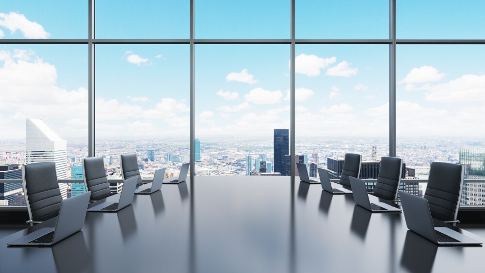 An empty conference room overlooking a city