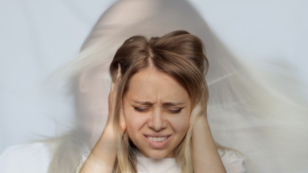 Pictured: Woman in mental anguish/iStock, Marina D