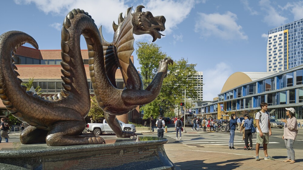 Photo of dragon statue and students at Drexel University