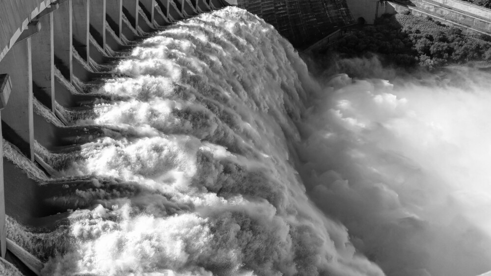 The Gariep Dam overflowing. The dam is the largest in South Africa. It is in the Orange River on the border between the Free State and Eastern Cape Provinces. Monochrome
