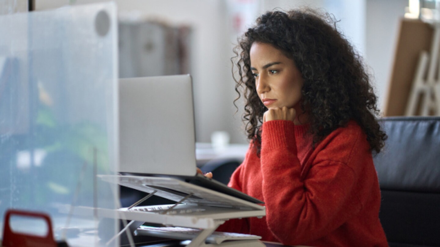 Pictured: A young woman at work on a computer/iSto
