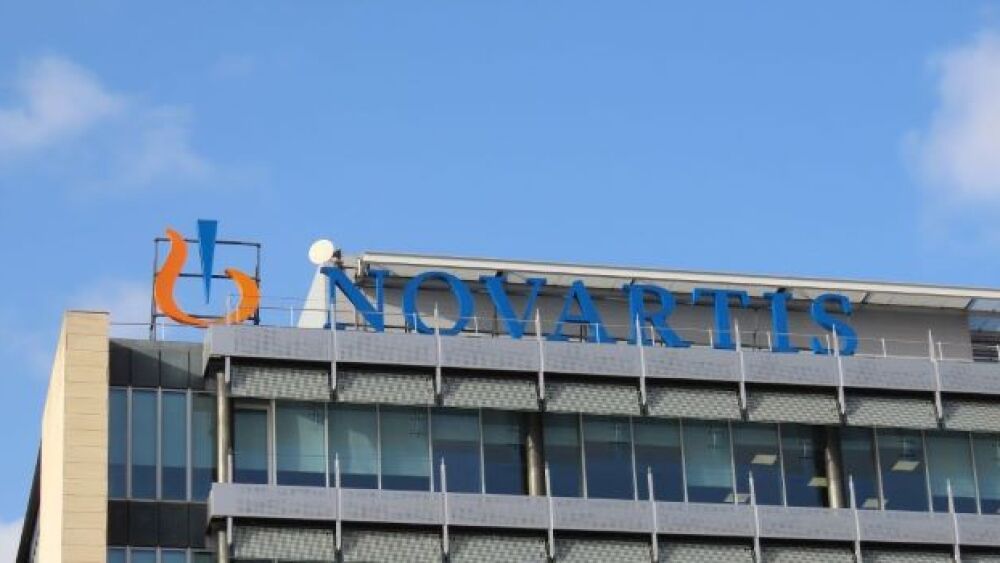 A Novartis building under a blue sky/courtesy of C