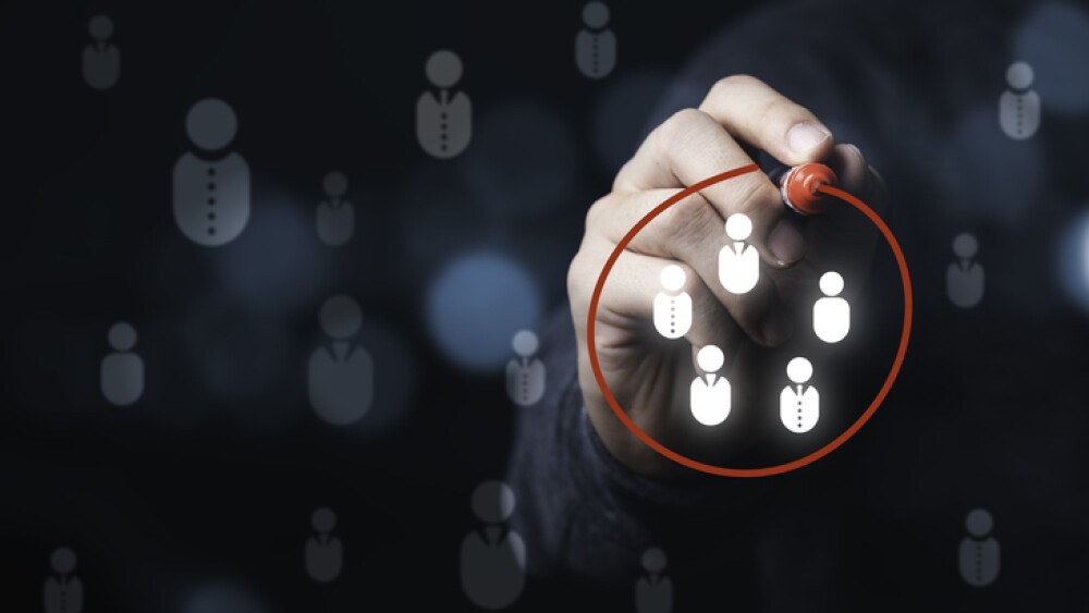 Businessman drawing red circle to marking and select human icons , Human development or marketing focus customer target group.