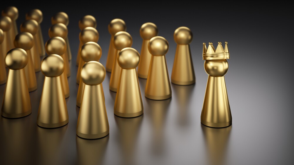 Golden game piece with crown as a leader a group of golden game pieces - 3D illustration