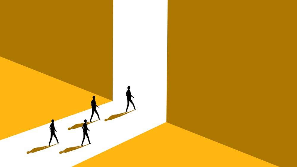 Employees walk toward exit