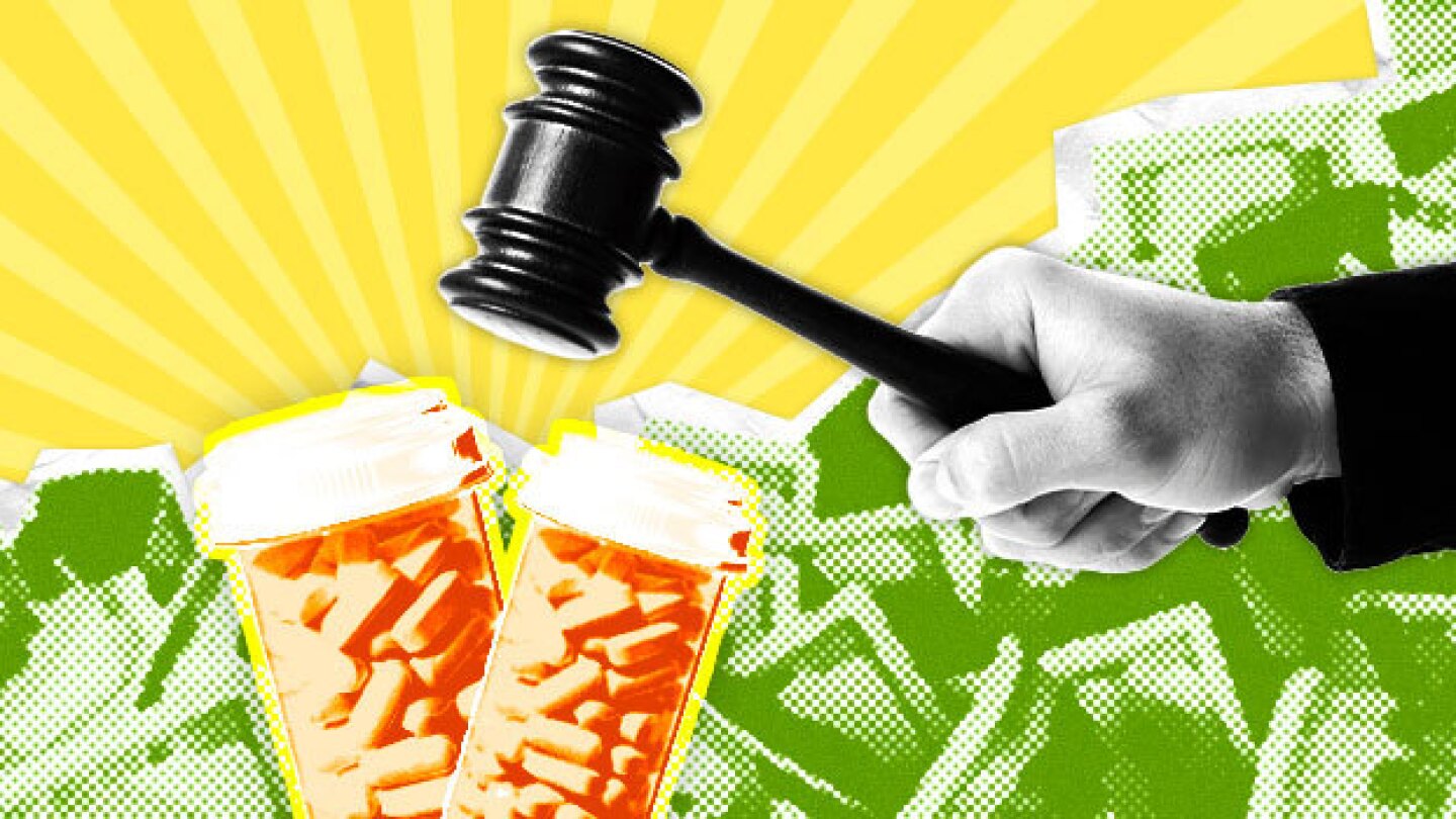 Pictured: Gavel hitting pill bottles with abstract money background