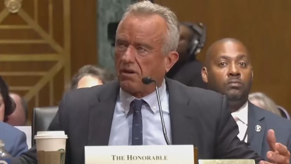 Robert F Kennedy Jr speaking in front of the Senate finance committee