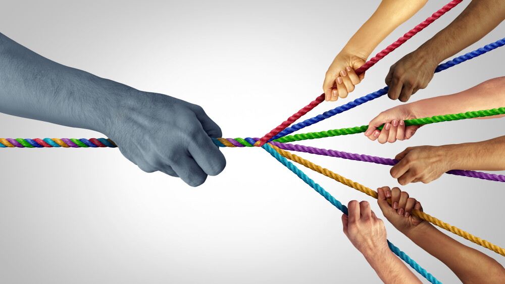 Team up and teaming together to fight a big power as a group concept joining and united as a strong partnership with a common goal in a teamwork effort pulling diverse ropes against a large power in a 3D illustration style.