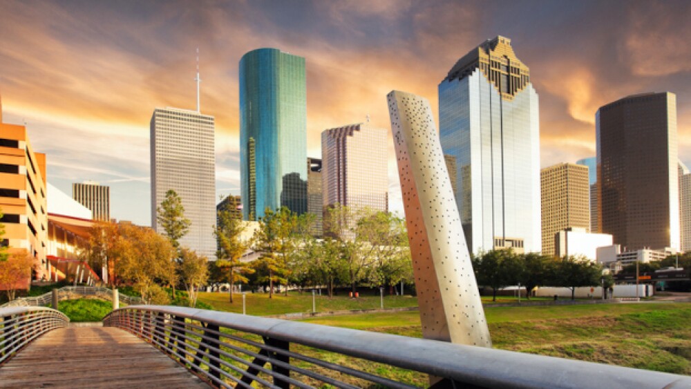 A park in Houston with skyscrapers in the backgrou