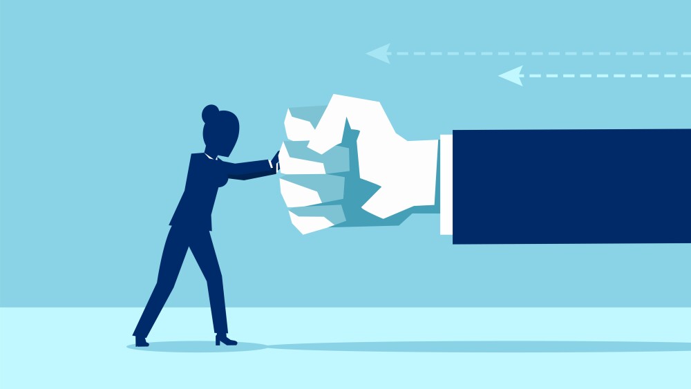 Vector of a woman fighting back a giant fist, protecting herself from work abuse or domestic violence