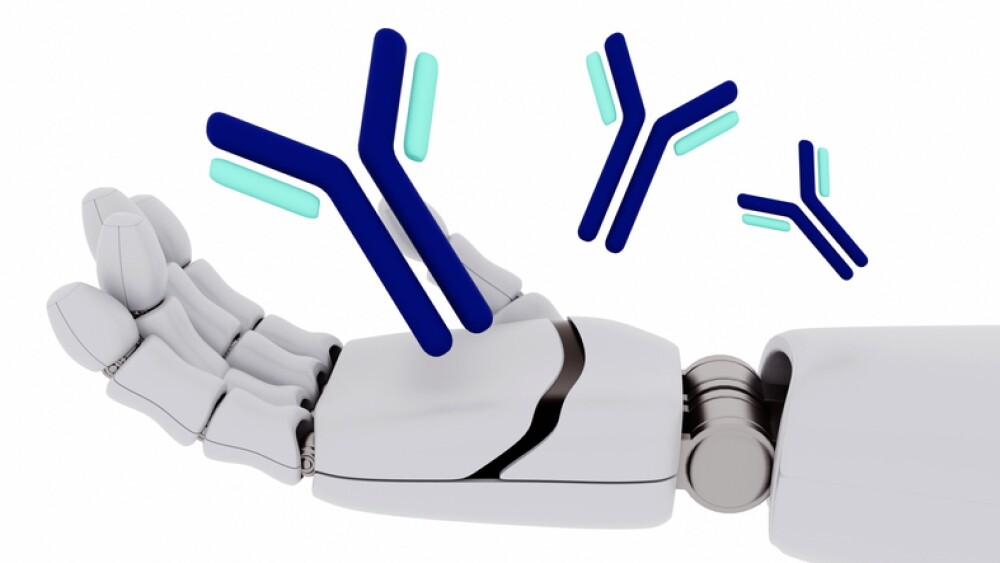 A 3D rendering depicts an antibody molecule floating above robotic hands against a white backdrop.