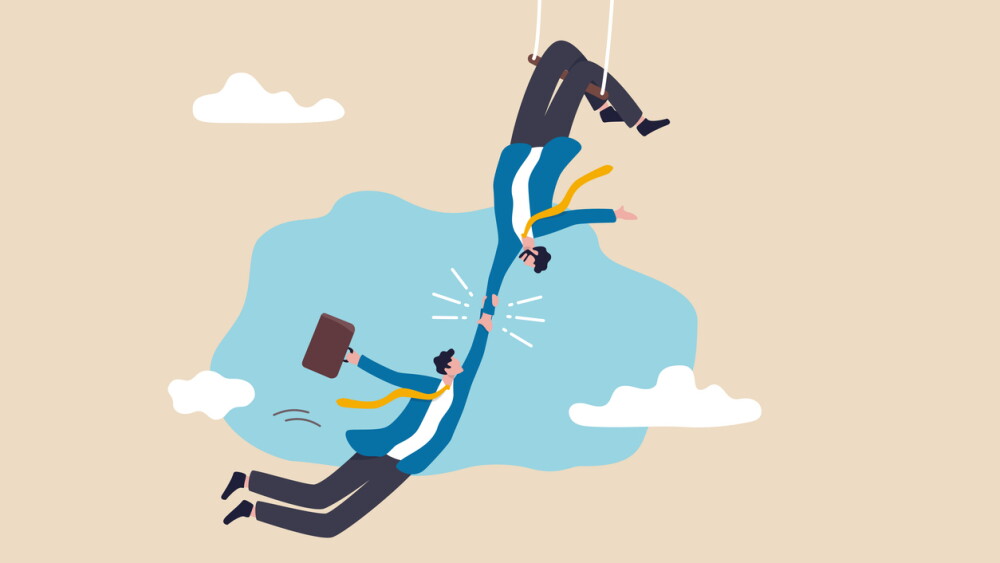 Trustworthy and honesty to believe in work together, integrity or trust for partnership, support and reliable to help success together concept, businessman acrobat hold hand tight by trusted partner.
