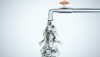Water tap dripping dollar bills on gray background. Business and financial success concept. 3D Rendering