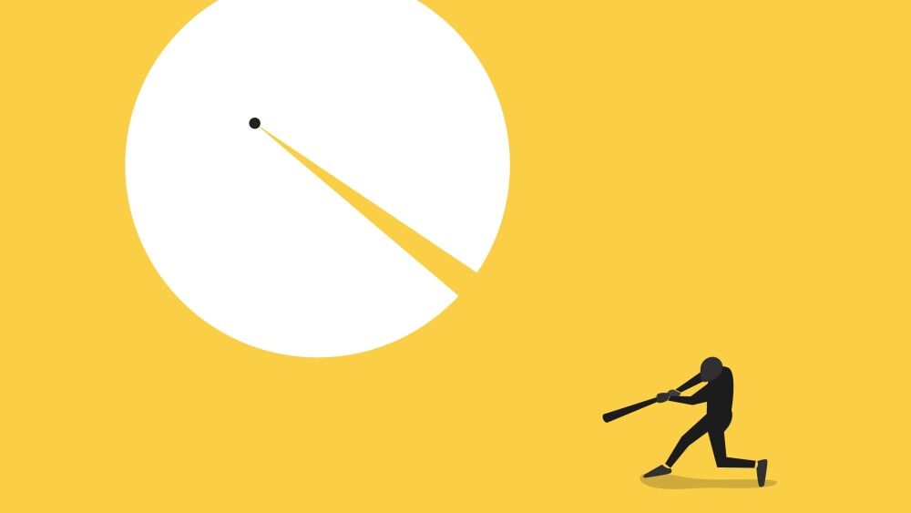 Businessman with baseball split huge ball