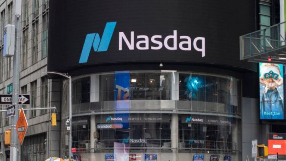 Pictured: Nasdaq signage and building in New York City