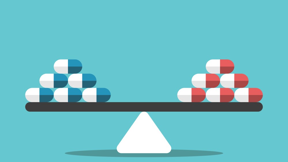 Different pills on seesaw weight scale. Comparison, choice, healthcare and medicine concept. Flat design. EPS 8 vector illustration, no transparency, no gradients