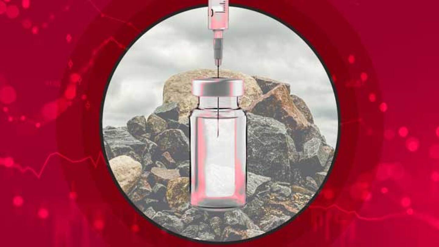Pictured: Medicine vial over rock pile with comple