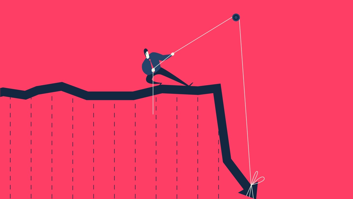 Businessman pulling rope trying to lift up falling graph.