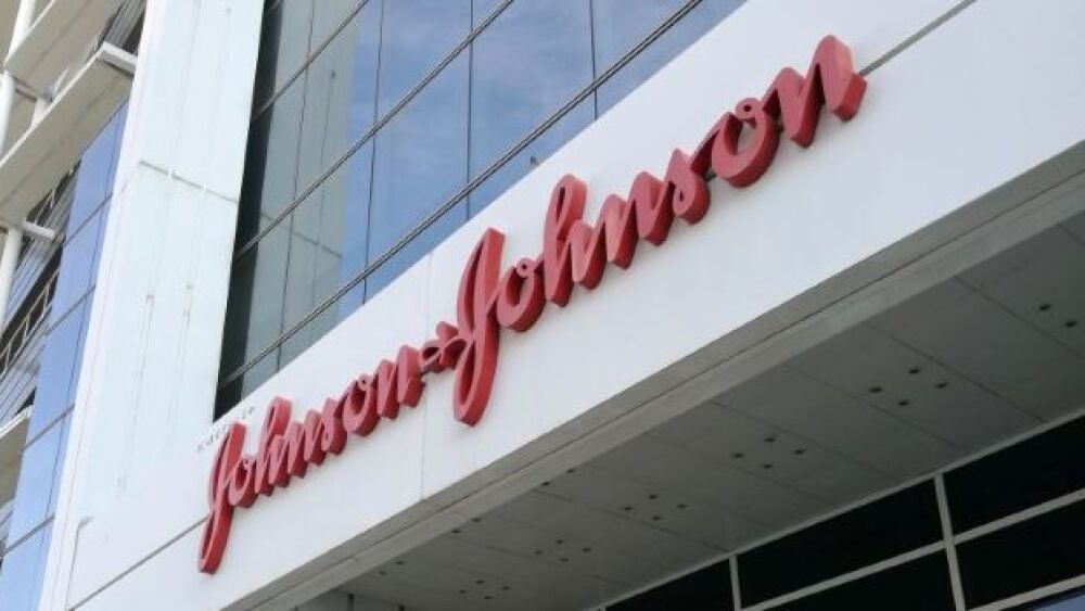 Pictured: J&J sign/Cristina Arias/Getty Images