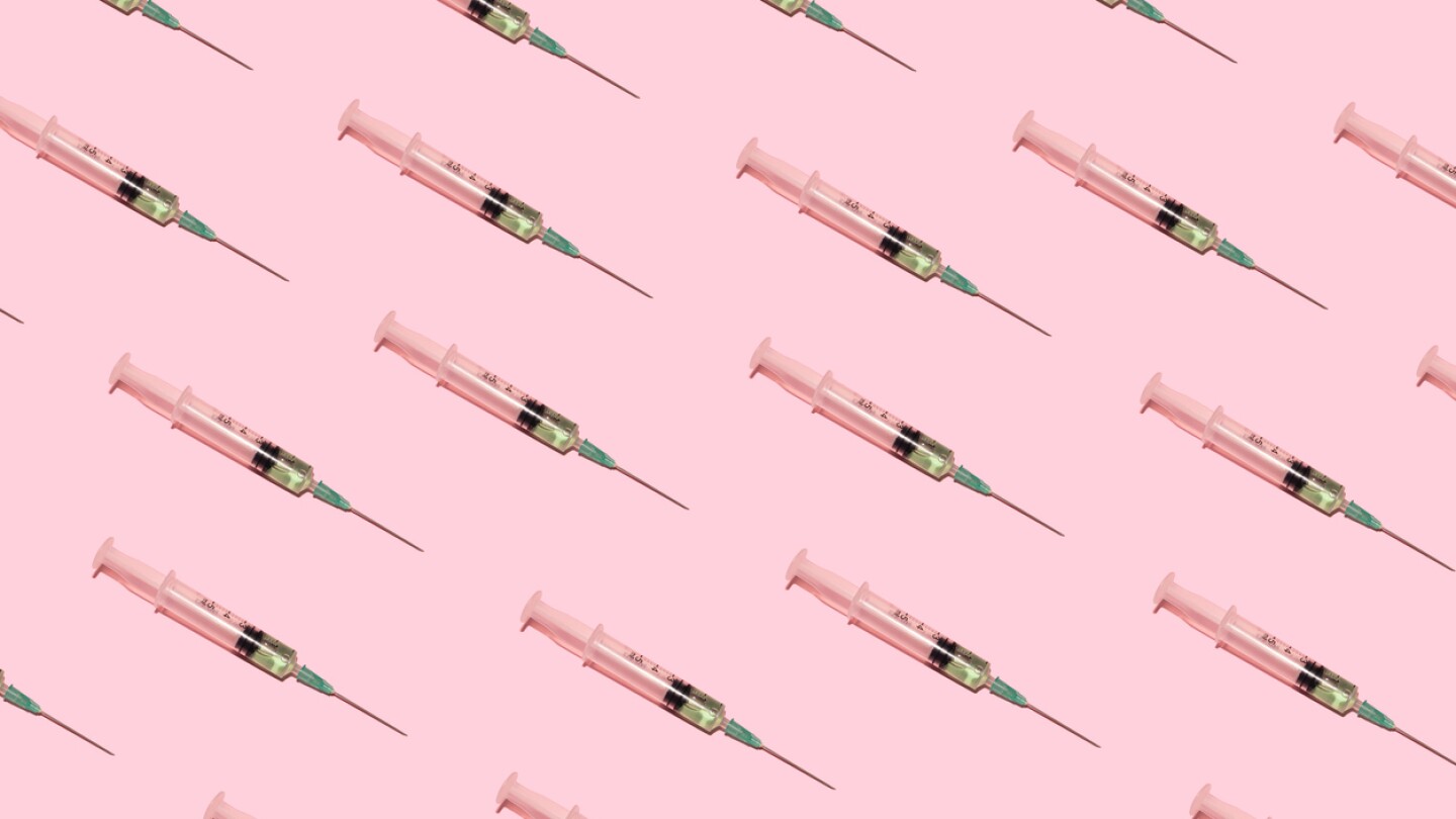 Creative pattern made with a syringe on pastel pink background. Vaccine for Coronavirus infection. Pandemic concept.
