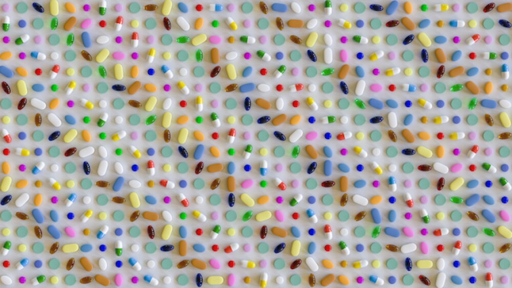 Pills organized in a digital pattern/iStock, EvilW