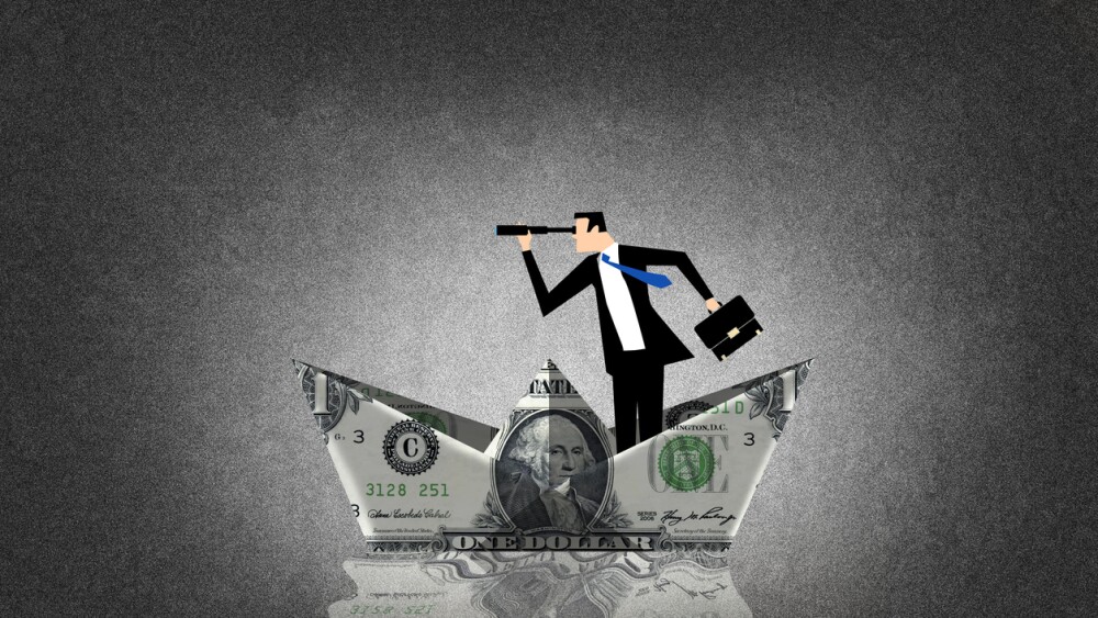 Man inside a boat made with a dollar