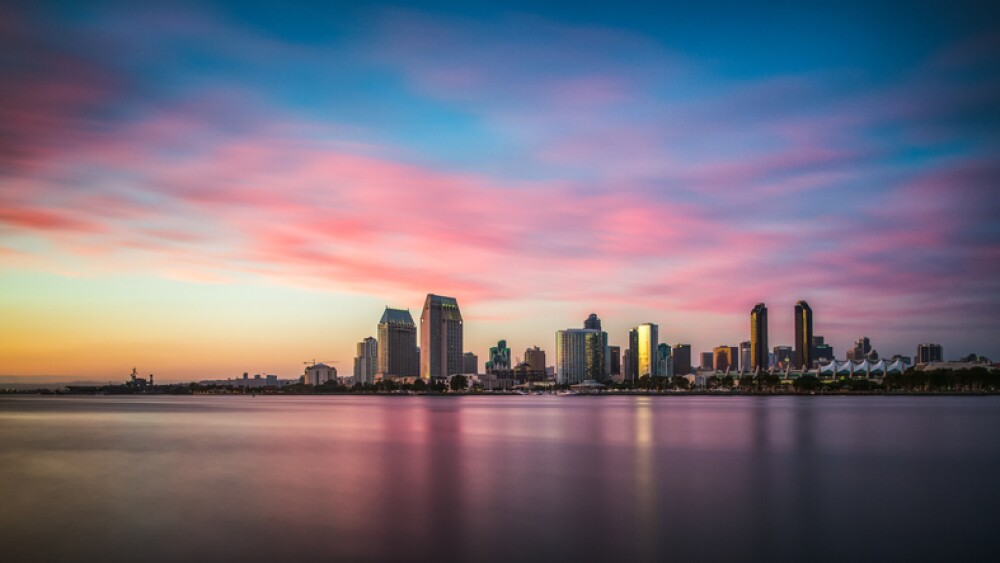 Sunset illuminating the tall skyscrapers of San Diego in California from Centennial Park in Coronado