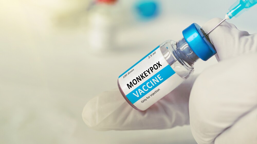 Healthcare worker draws from a vial of an mpox vaccine