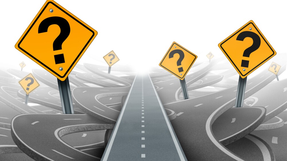 Solution and strategy path questions and clear planning for ideas in business leadership with a straight path to success choosing the right strategic plan with yellow traffic signs cutting through a maze of highways.