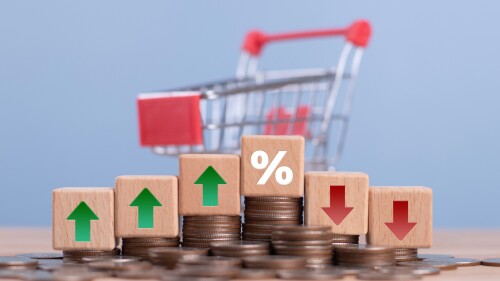 Interest rate and tax concept. A percentage symbol and arrow symbol on wooden cube. Interest rates continue to increase, return on stocks and mutual. funds, finance, growth, increase, profit. FED.