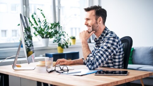 A man searching for the best remote companies to w