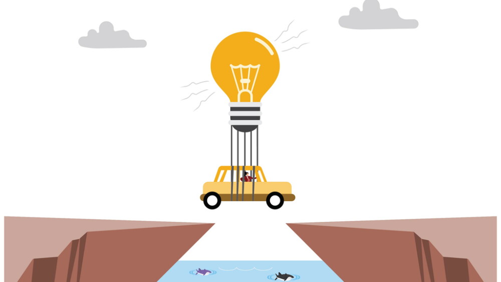 Businesswoman driving a car and floating with an idea light bulb hot air balloon over the edge of a cliff