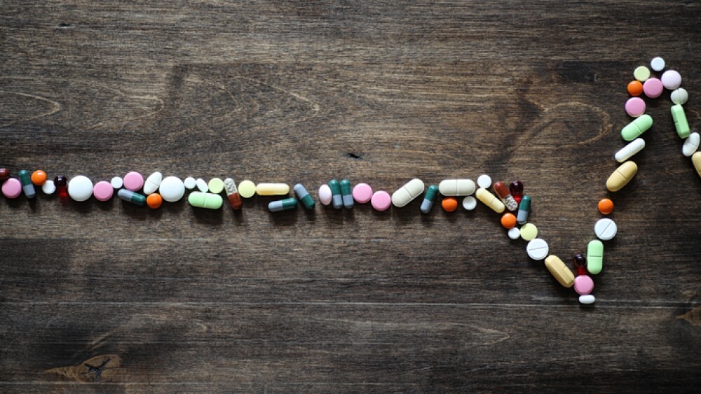 The concept of medical care for heart disease cardiac rhythm in the chart of tablets