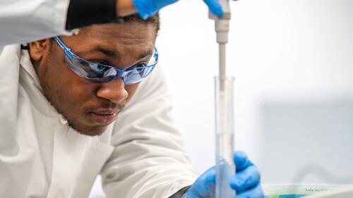 Bioversity graduate Josiah Wade-Green uses a pipet