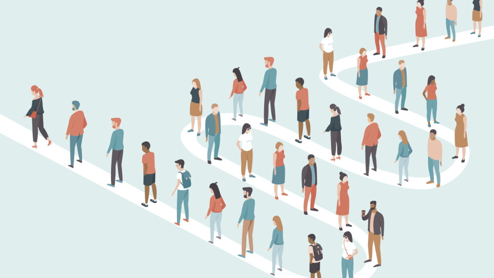 Large group of people standing in long line