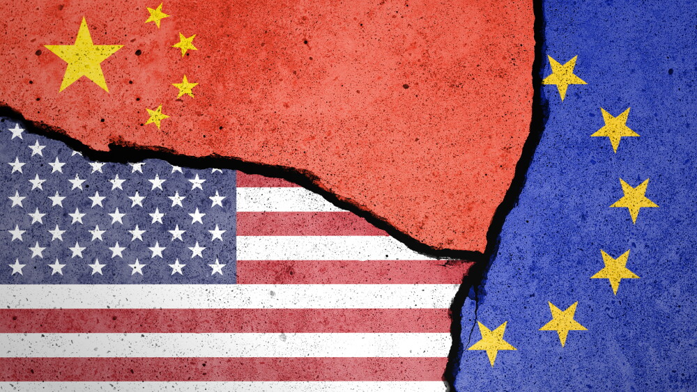 Flags of US, EU and China painted on cracked wall with people shadow
