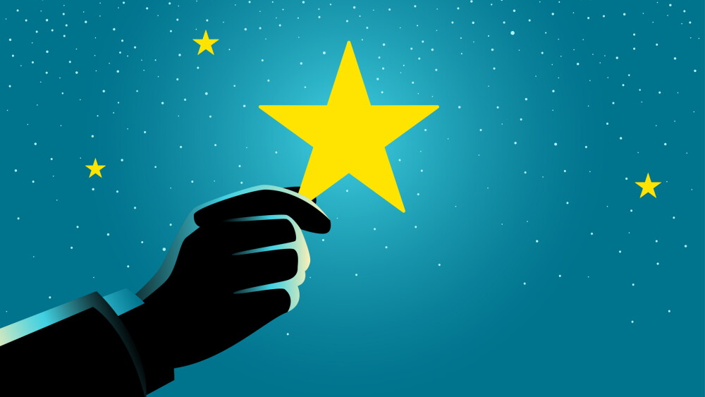 Concept illustration of a businessman hand picking up a star