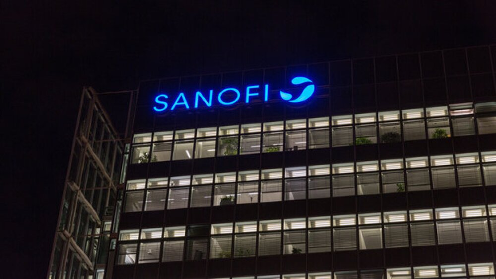 Pictured: Blue Sanofi sign on building in Germany at night