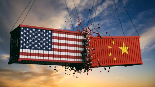 USA and China trade war. US of America and chinese flags crashed containers on sky at sunset background. 3d illustration