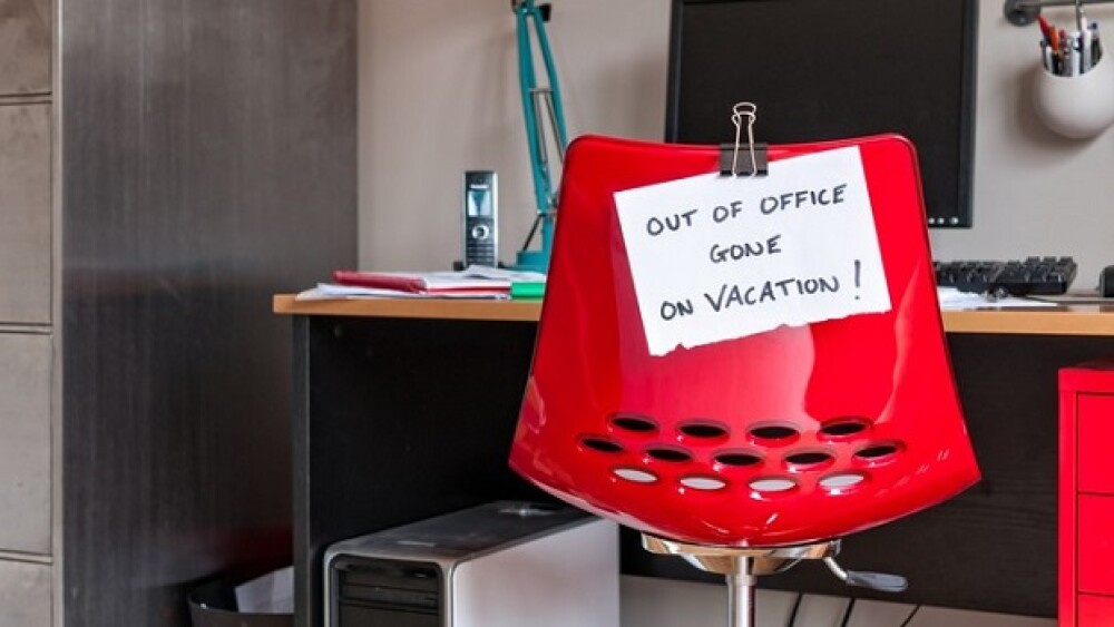 Pictured: Desk chair with sign attached that reads