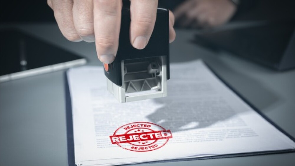 Pictured: Rejected stamp/iStock, Pavel Muravev