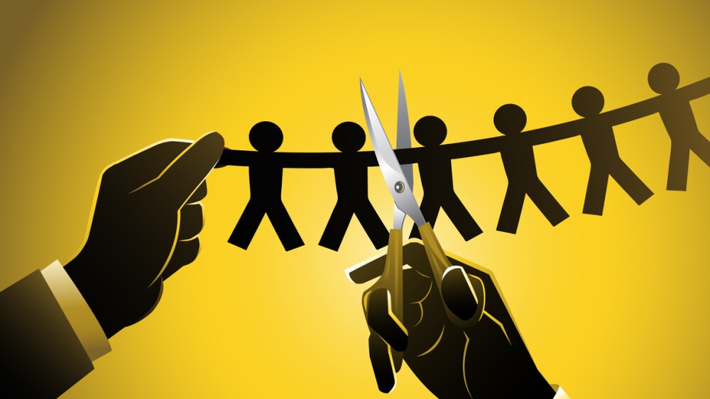 Businessman makes employee cuts as part of layoff