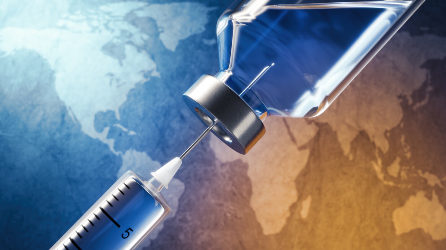 Covid-19, Coronavirus vaccine in vial with syringe on blue earth map background