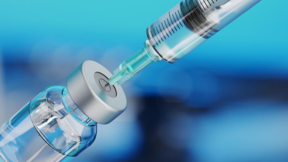 Pictured: Syringe Drawing Up Drug from Vial/iStock