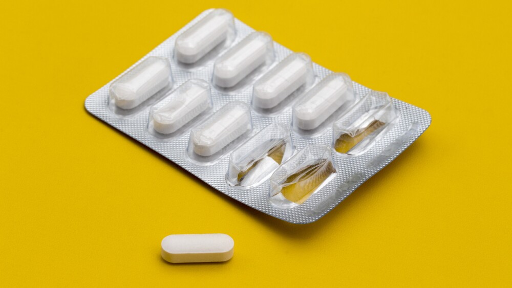 pills Medicine tablet in blister pack on a yellow background