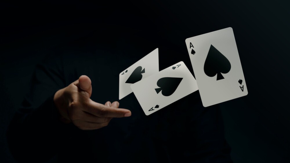 Ace Spade Playing Card. Player or Magician Flick and Levitating Poker Card by Hand. Front View. Closeup and Dark Tone